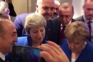 Angela Merkel, Theresa May şi Erdogan, surprinşi în timp ce se uită pe telefon la meciul Anglia-Croaţia VIDEO