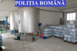 Percheziţii într-un dosar de spălarea banilor: poliţiştii covăsneni au confiscat mii de pachete de ţigări şi peste 100 de litri de alcool