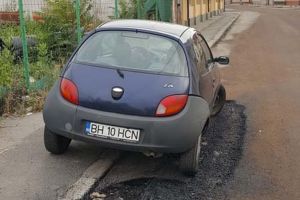 Dorel Viteazul: Muncitorii care au reabilitat o stradă din Oradea au asfaltat în jurul unei maşini! (FOTO)