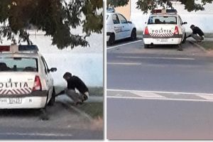 Tânăr fotografiat în timp ce dezumflă roţile maşinilor de poliţie, în faţa Secţiei 3 Timişoara
