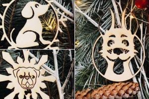 FOTO: Iniţiativă inedită a Asociaţiei „Prietenii lui Azor”. Globuleţe de lemn în formă de căţei, în schimbul unei donaţii pentru necuvântătoarele din Ecarisajul Alba Iulia