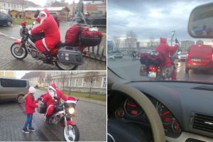 FOTO/VIDEO: Un Moş Crăciun enigmatic împarte cadouri copiilor din Alba Iulia de pe… motocicletă. A fost văzut în trafic şi numeroase cartiere din oraş