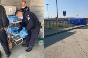 OAMENI pe timp de criză. Jandarmii distribuie gratuit apă şi batoane de ciocoaltă pe A1, pentru a-i ajuta pe cei veniţi din diaspora, donate de Clubul Rotary Alba Iulia