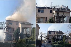 FOTO. Casă cuprinsă de flăcări din cauza unui inconştient. Proprietara, transportată la spital