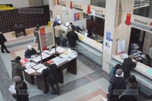 Clientii scapa de grija completarii formularelor cu pixul, la ghiseele Postei Romane